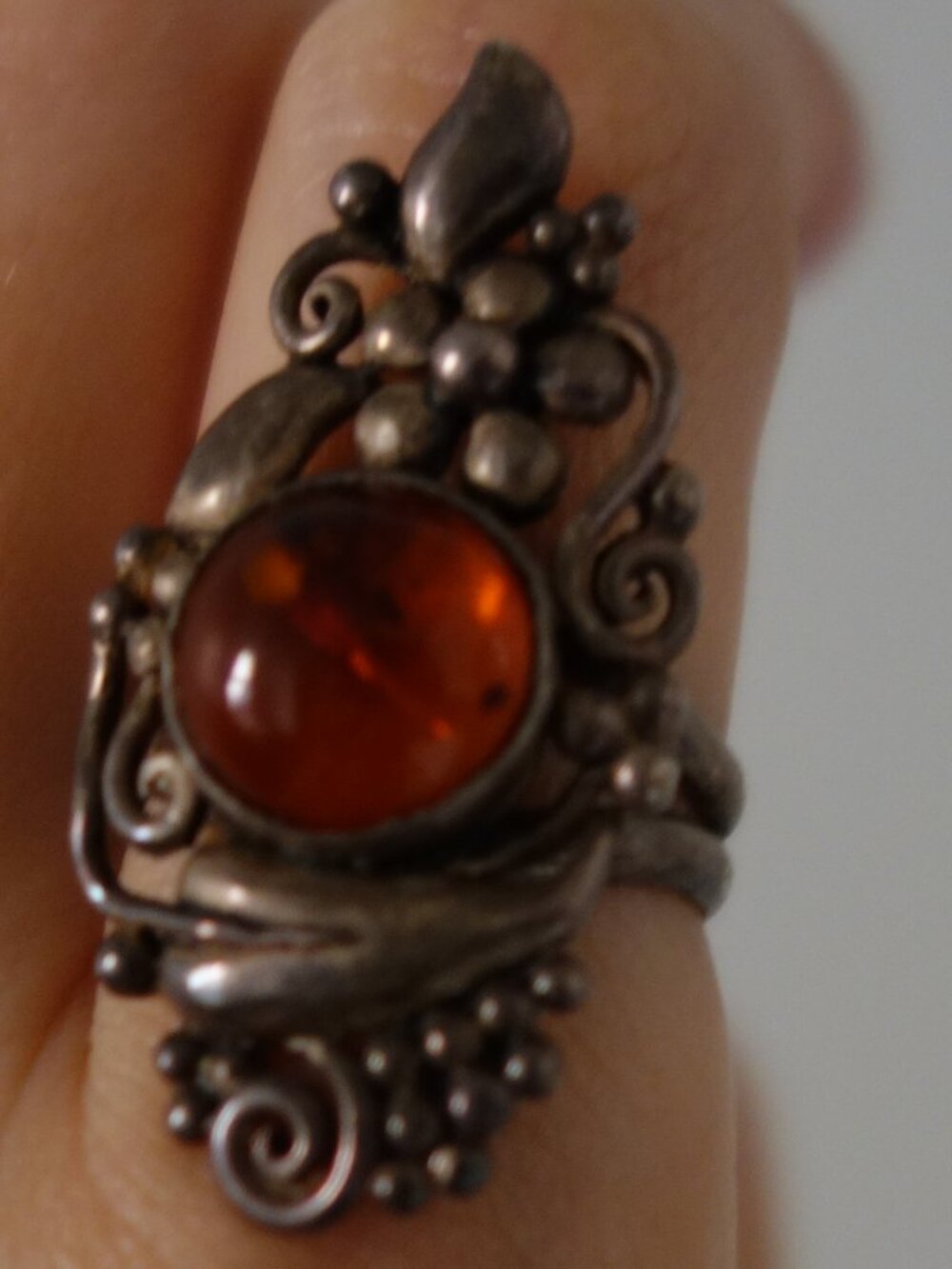 Ornate silver ring with stone